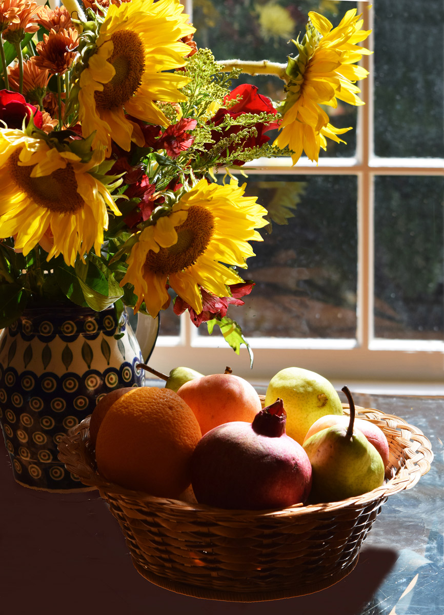 the muse — sunflowers and fruit by the window